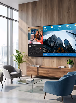 Modern living room with a large TV screen showing news and weather, surrounded by stylish chairs and plants.
