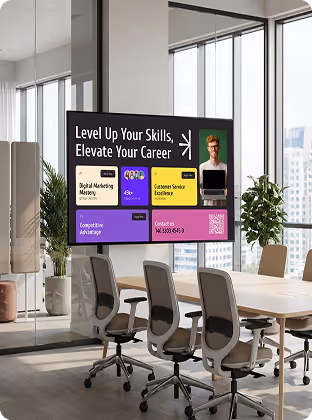 Office conference room with chairs and a screen showing a career skills advertisement.