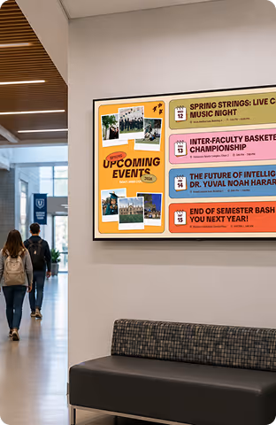 Digital board in hallway listing upcoming campus events with dates and titles in colorful blocks.